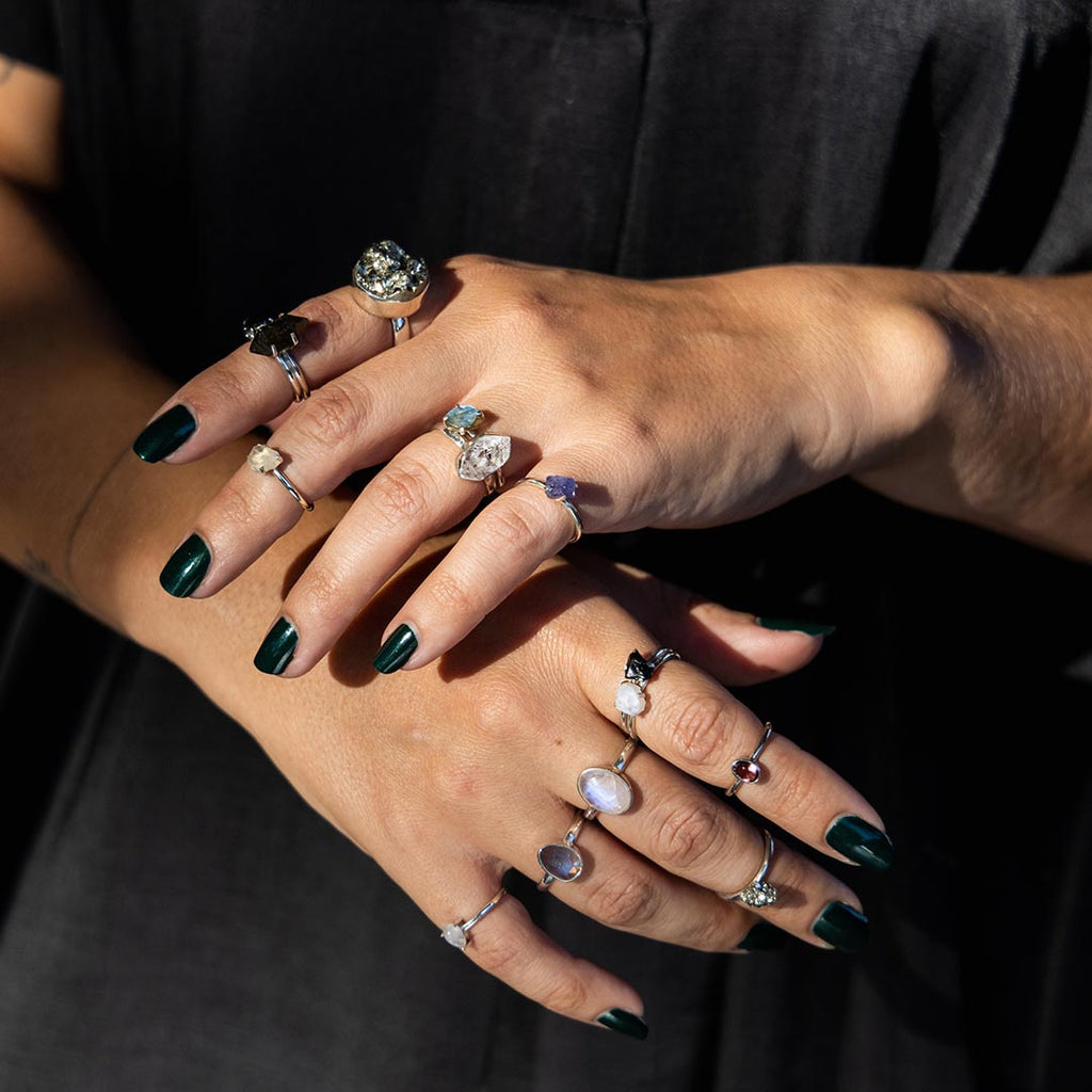 Several crystal rings of various colors and sizes